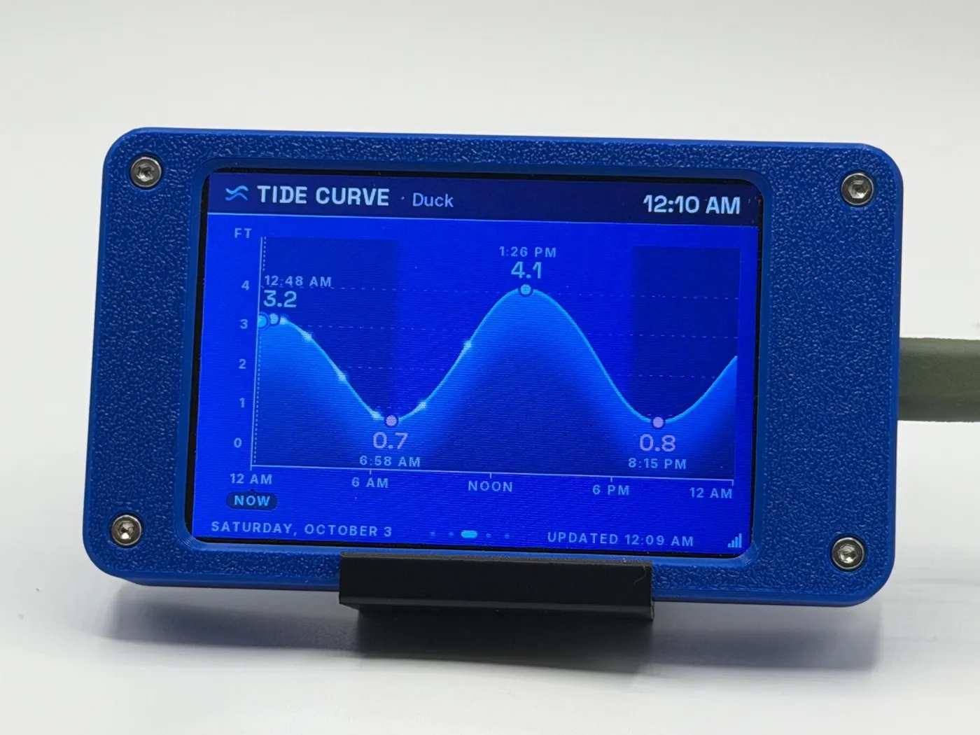 Tide Station on its stand showing the Tide Curve screen for Duck, North Carolina: highs of 3.2 and 4.1 ft, lows of 0.7 and 0.8 ft