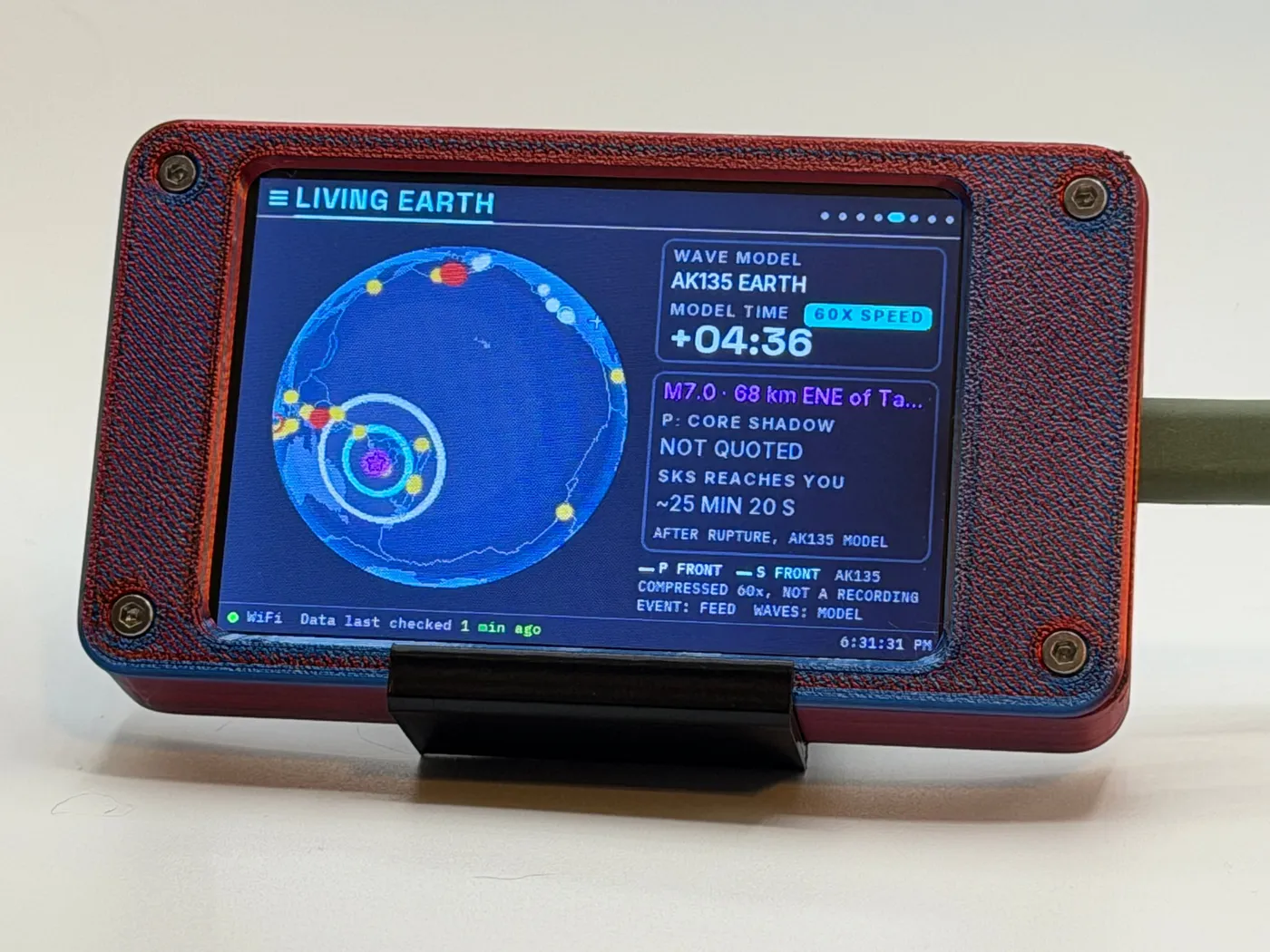 Seismic Sentinel in the Hyper Red/Blue enclosure, showing Living Earth during a wave pass: the globe turned to the M7.0 off New Caledonia with its P and S wave rings spreading, a 60X SPEED badge, and the S wave reaching home about 25 minutes after the rupture by the AK135 model