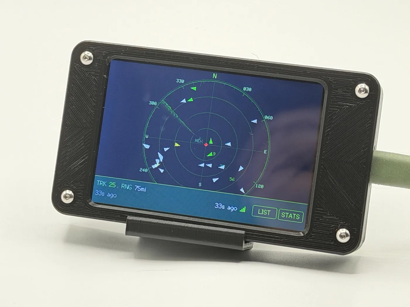 Green radar scope with aircraft blips and heading vectors, updated 33 seconds ago