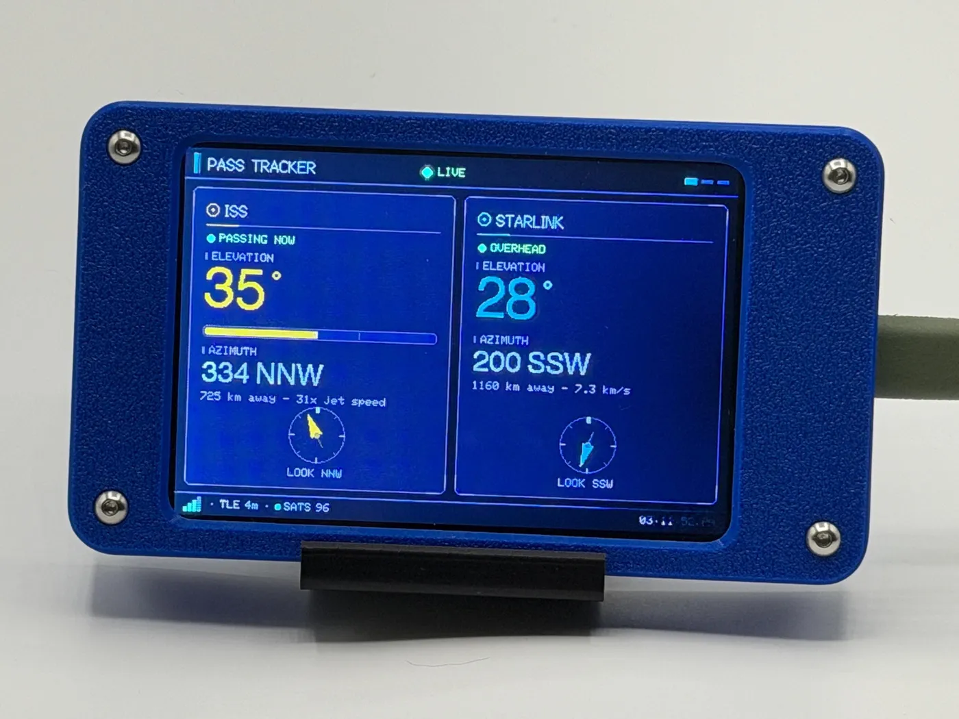 Satellite Sentinel on a desk in its blue enclosure