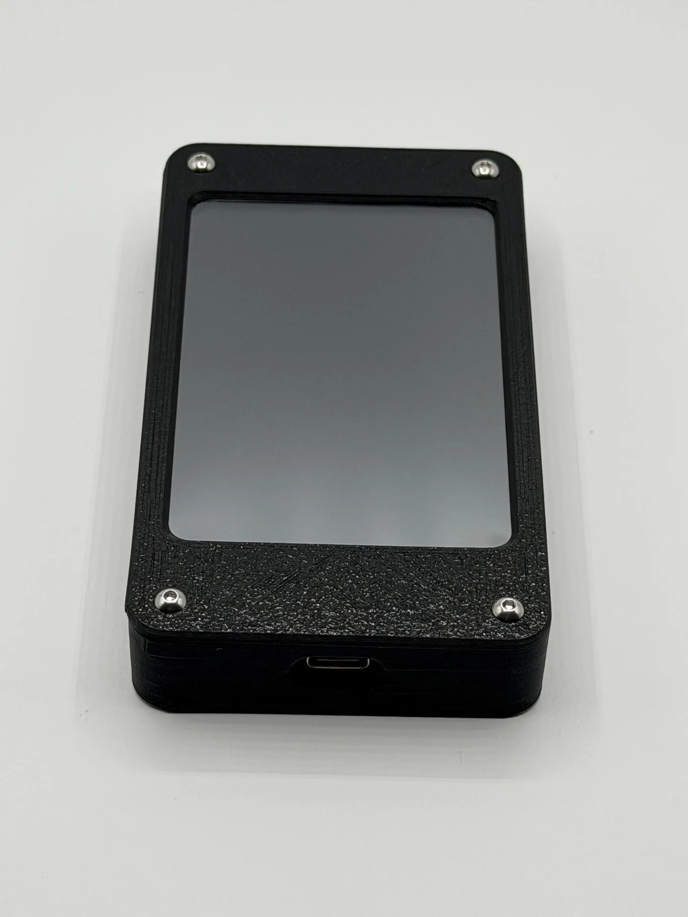 Front view of the black textured enclosure with USB-C port