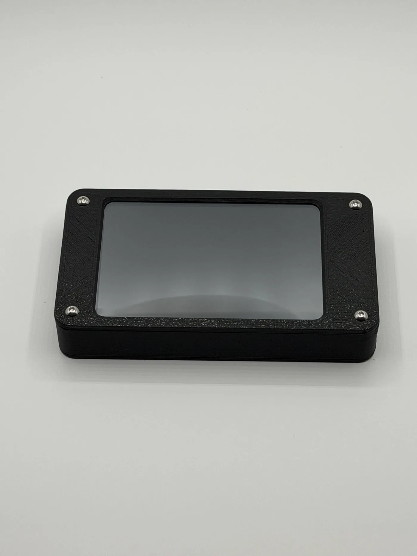Matte black 3D-printed enclosure with silver corner screws
