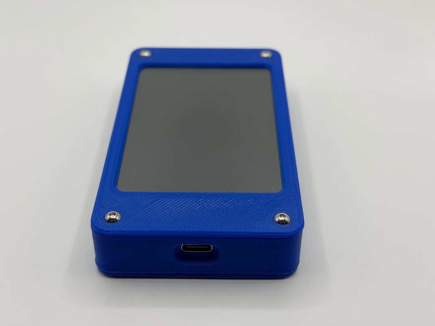 Blue enclosure detail with USB-C port on the bottom edge