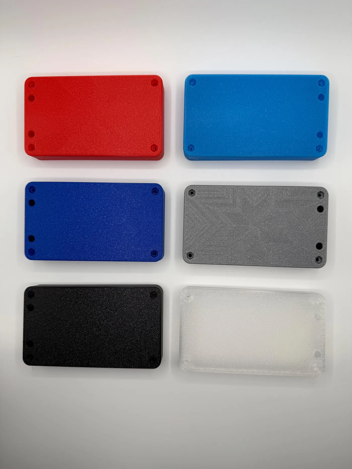 Enclosure color options, including red, blue, gray, and black shells